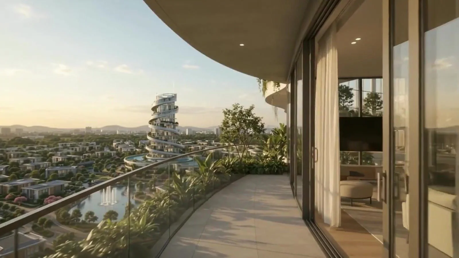 A curved hotel balcony at golden hour looking over the city to the spiral Centre
